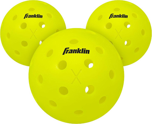 Three yellow Franklin pickleball balls sit against a white background.