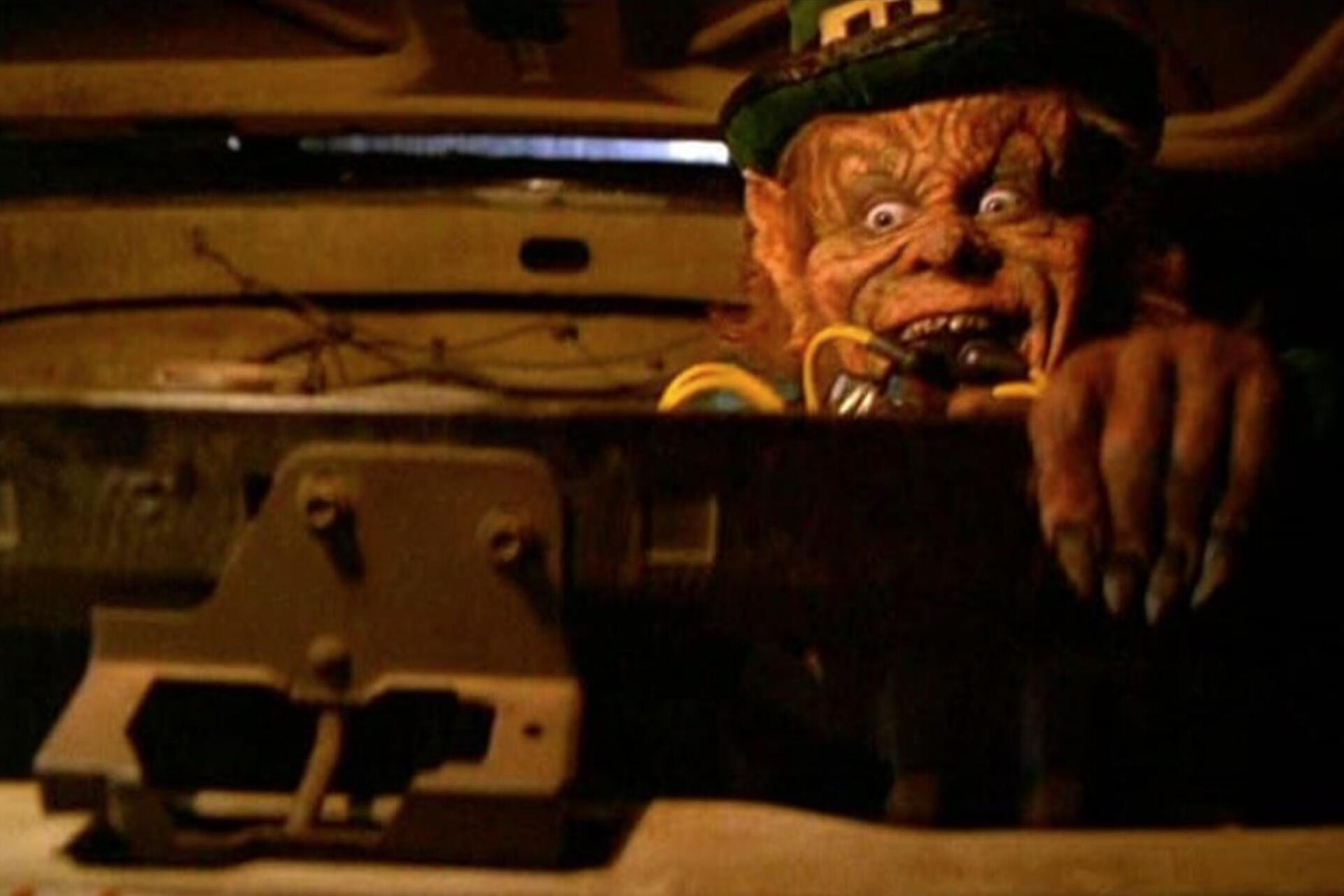 Leprechaun movie character behind a box