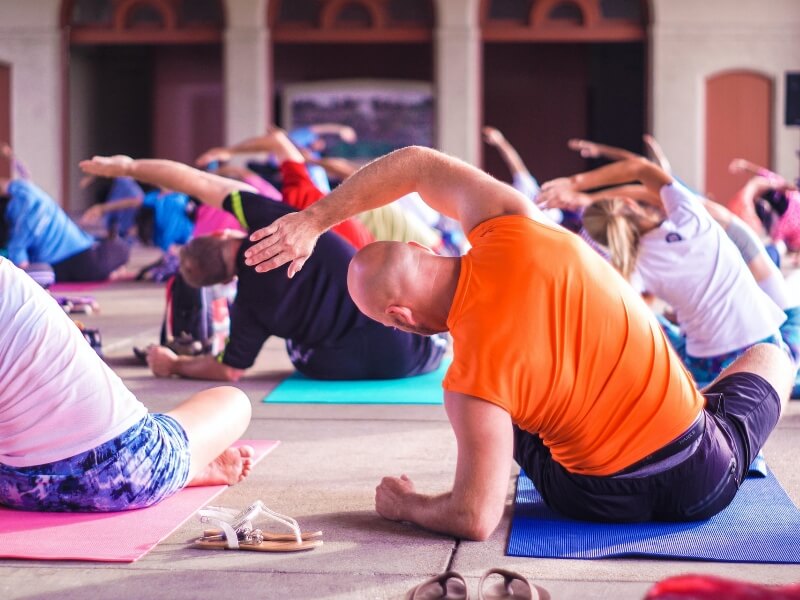 Group of people doing yoga.