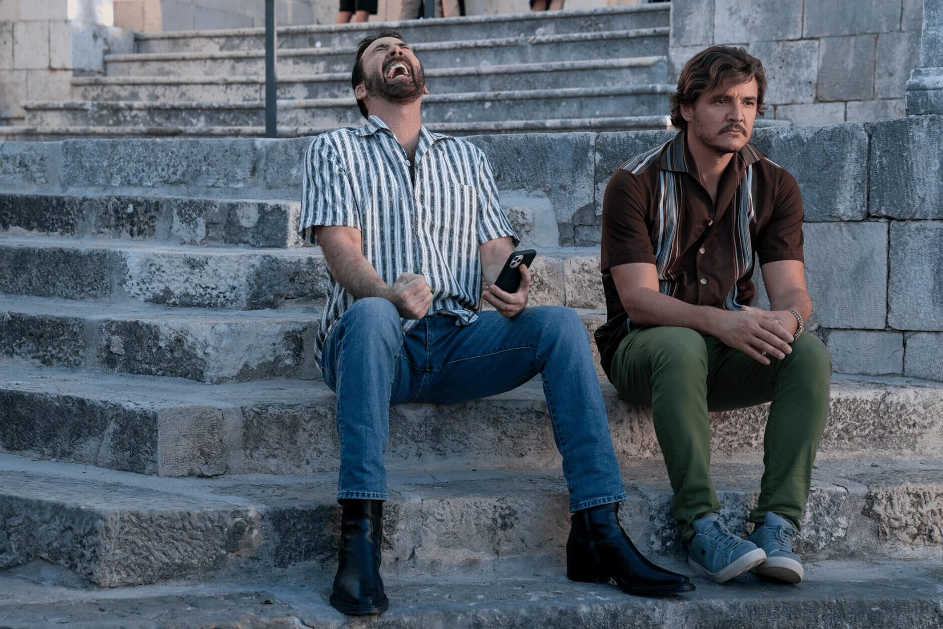 Pedro Pascal as Javi Gutiérrez and Nicolas Cage as Nicolas Cage in The Unbearable Weight of Massive Talent