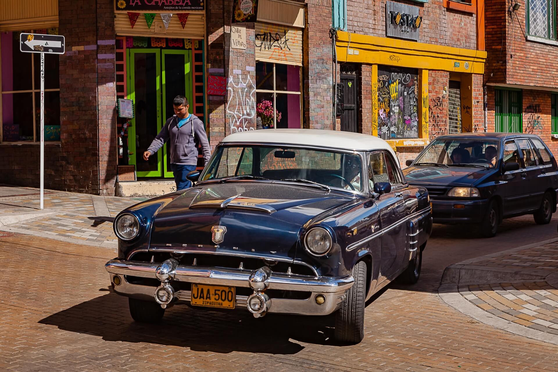 Dark blue Ford Mercury.
