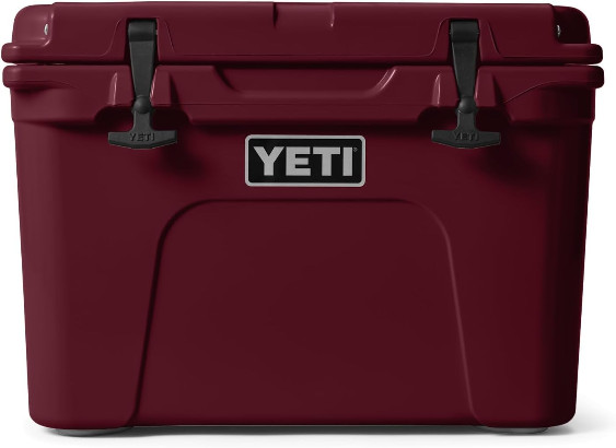 A maroon YETI cooler sits against a white background.