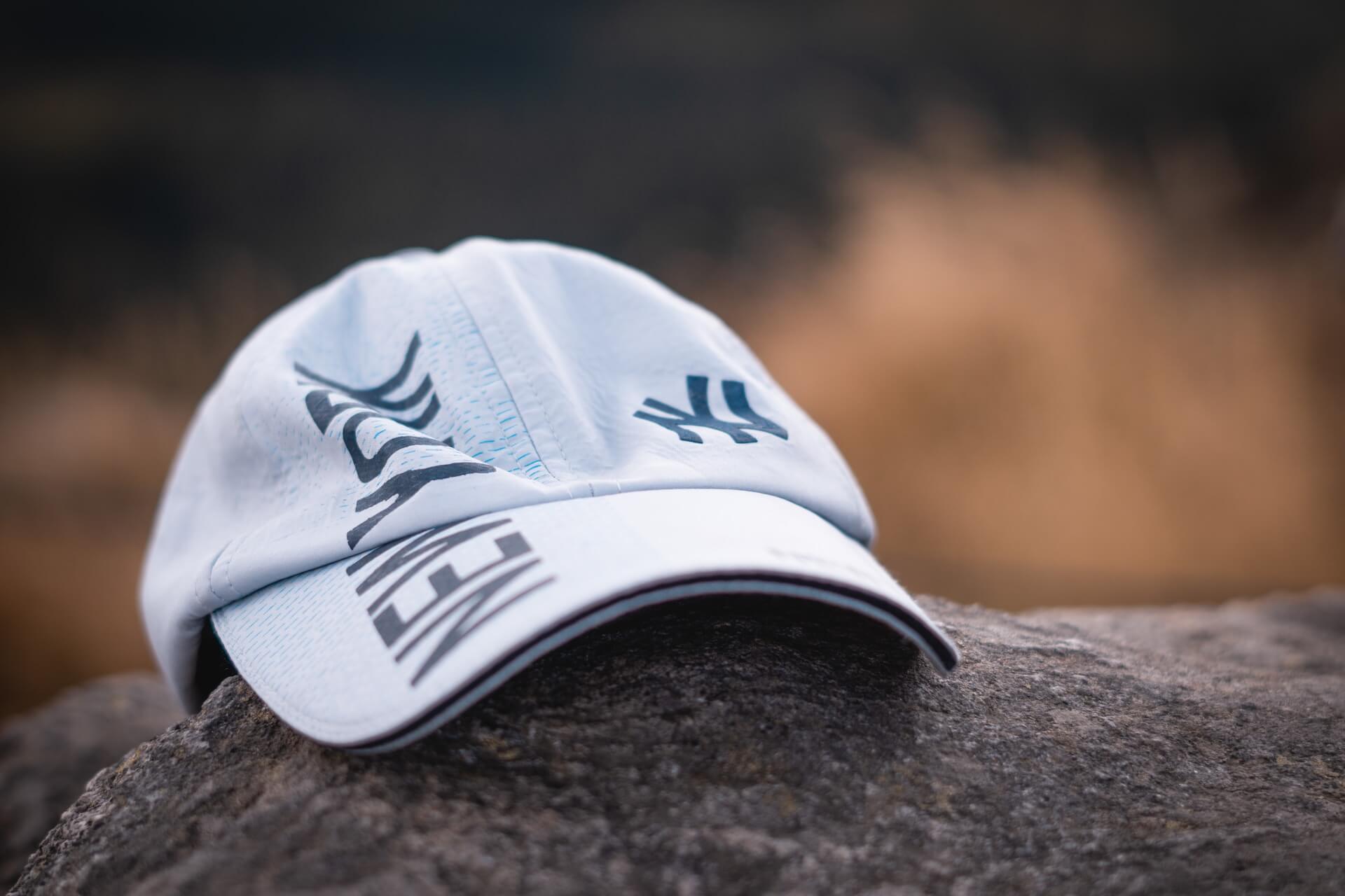 White New York Yankees hat rests on a rock.