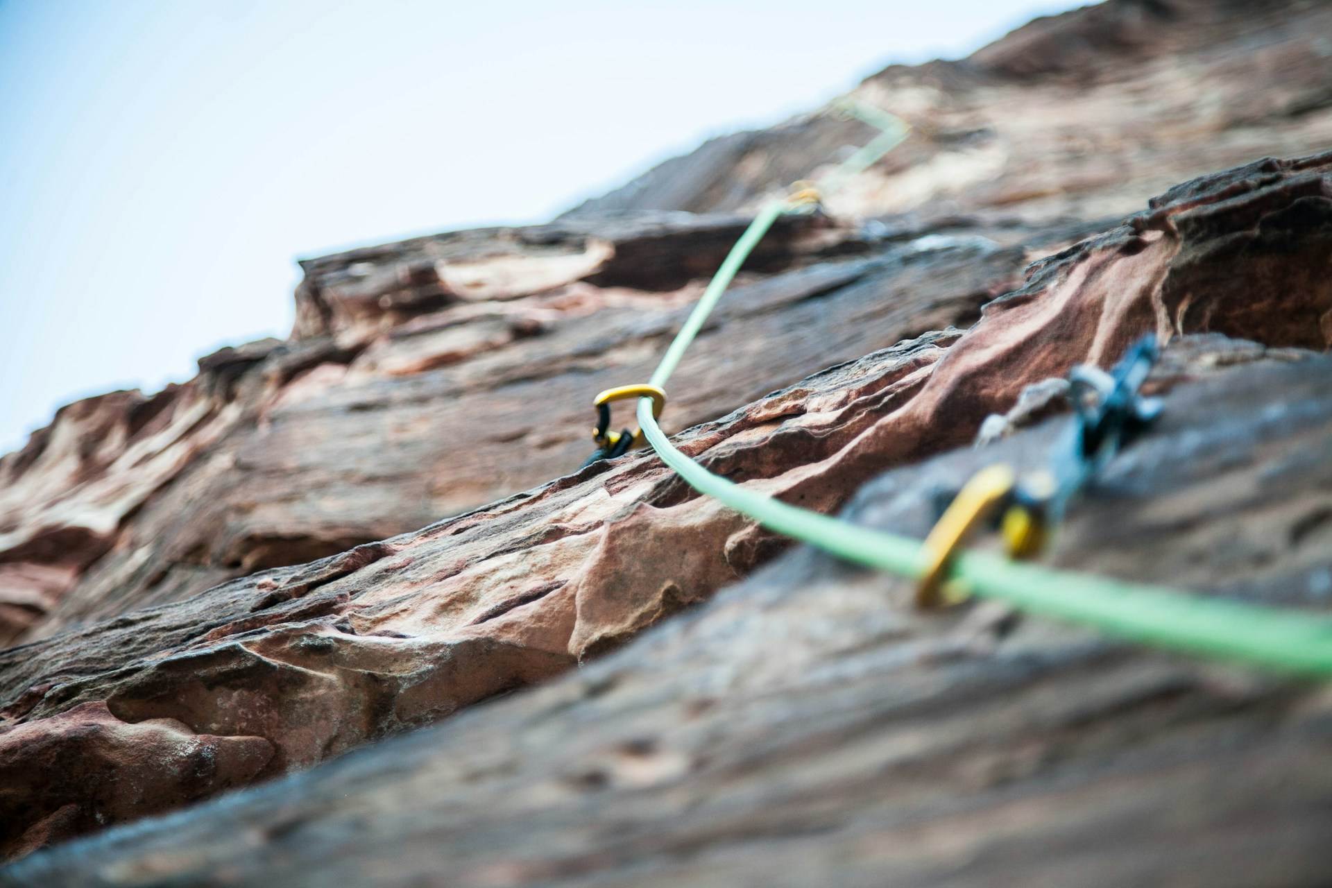 a climbing rope going up a mountain