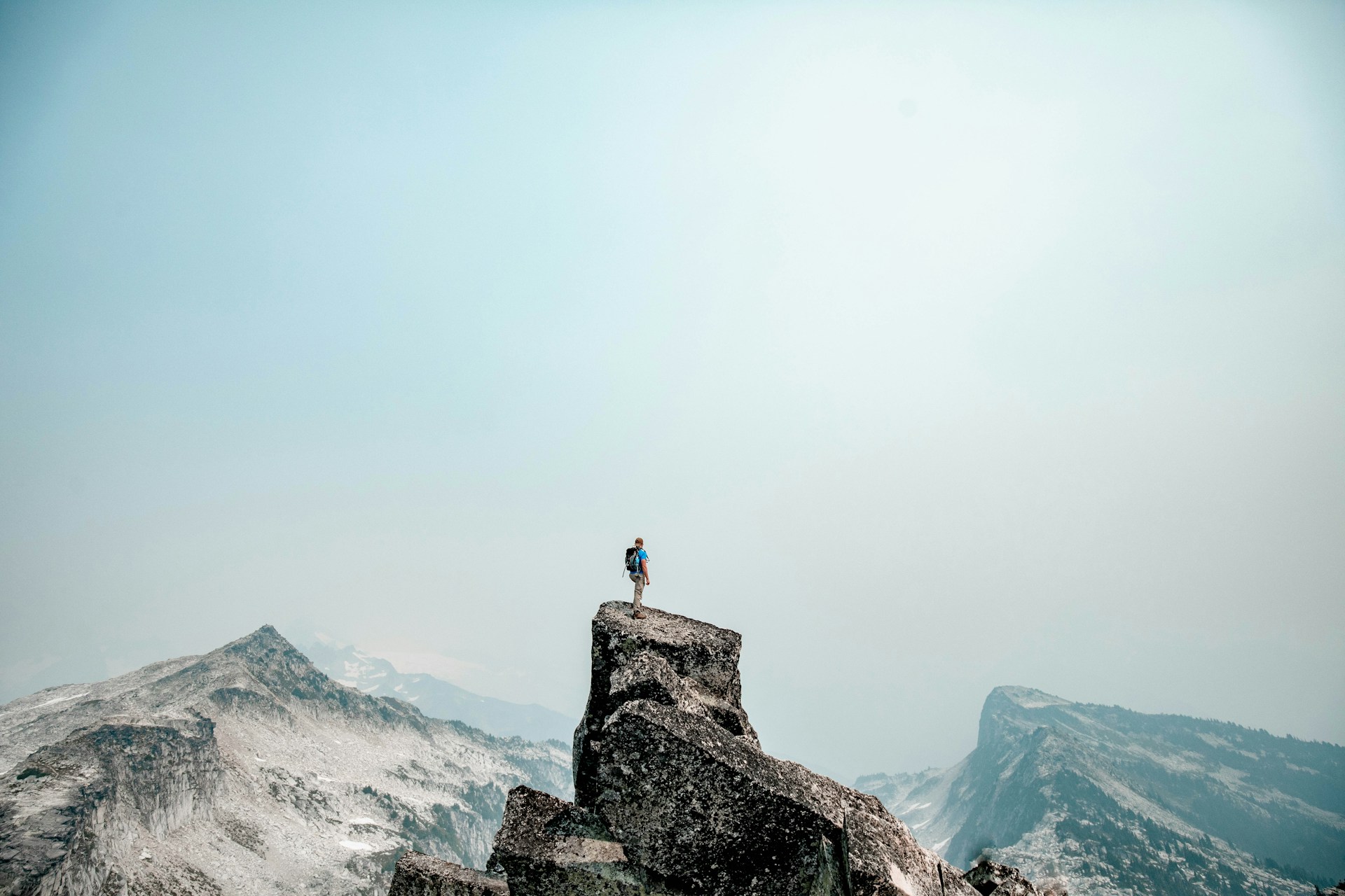 A man standing on top of a mountain