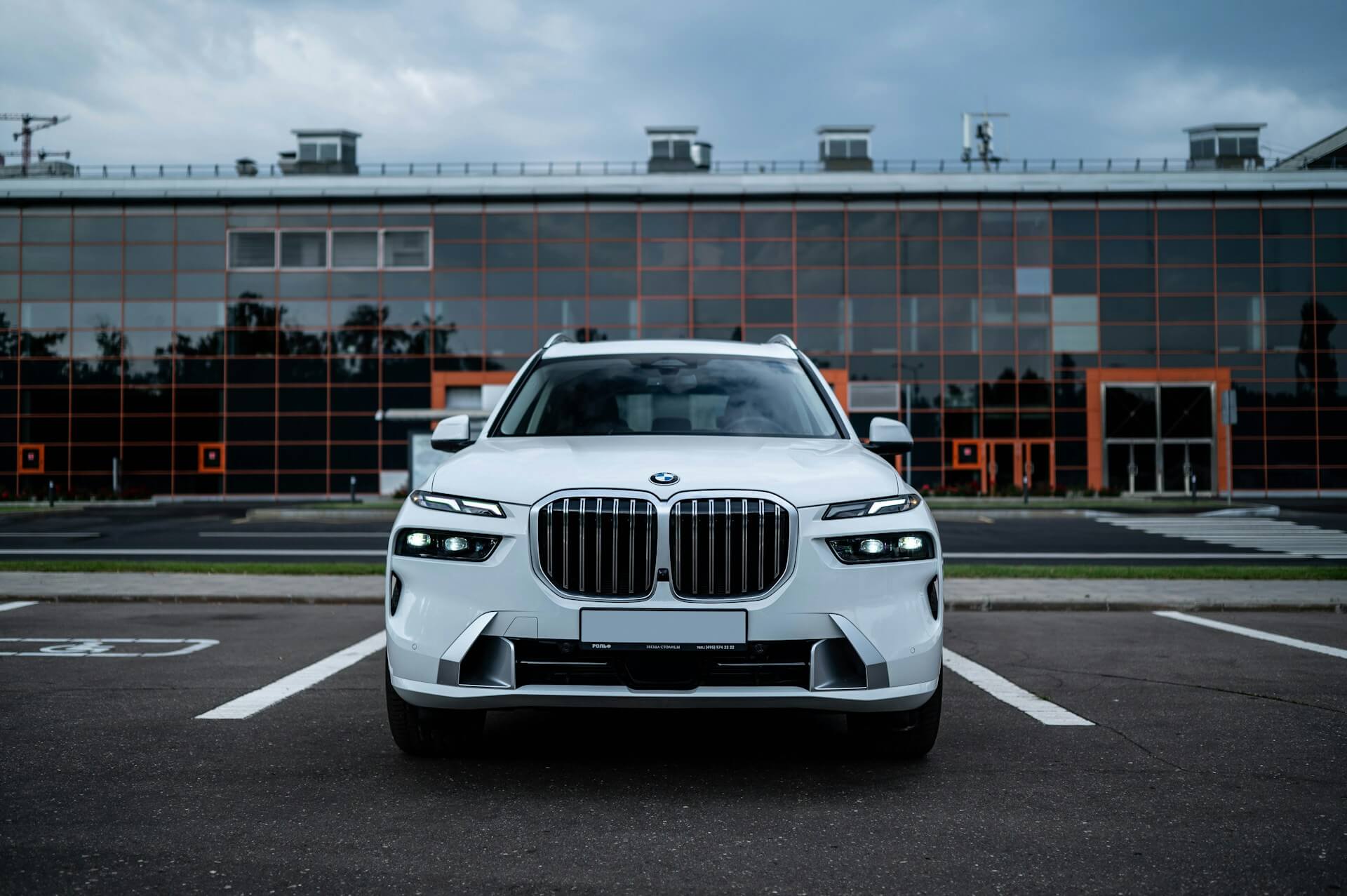 White BMW X7 in a parking lot
