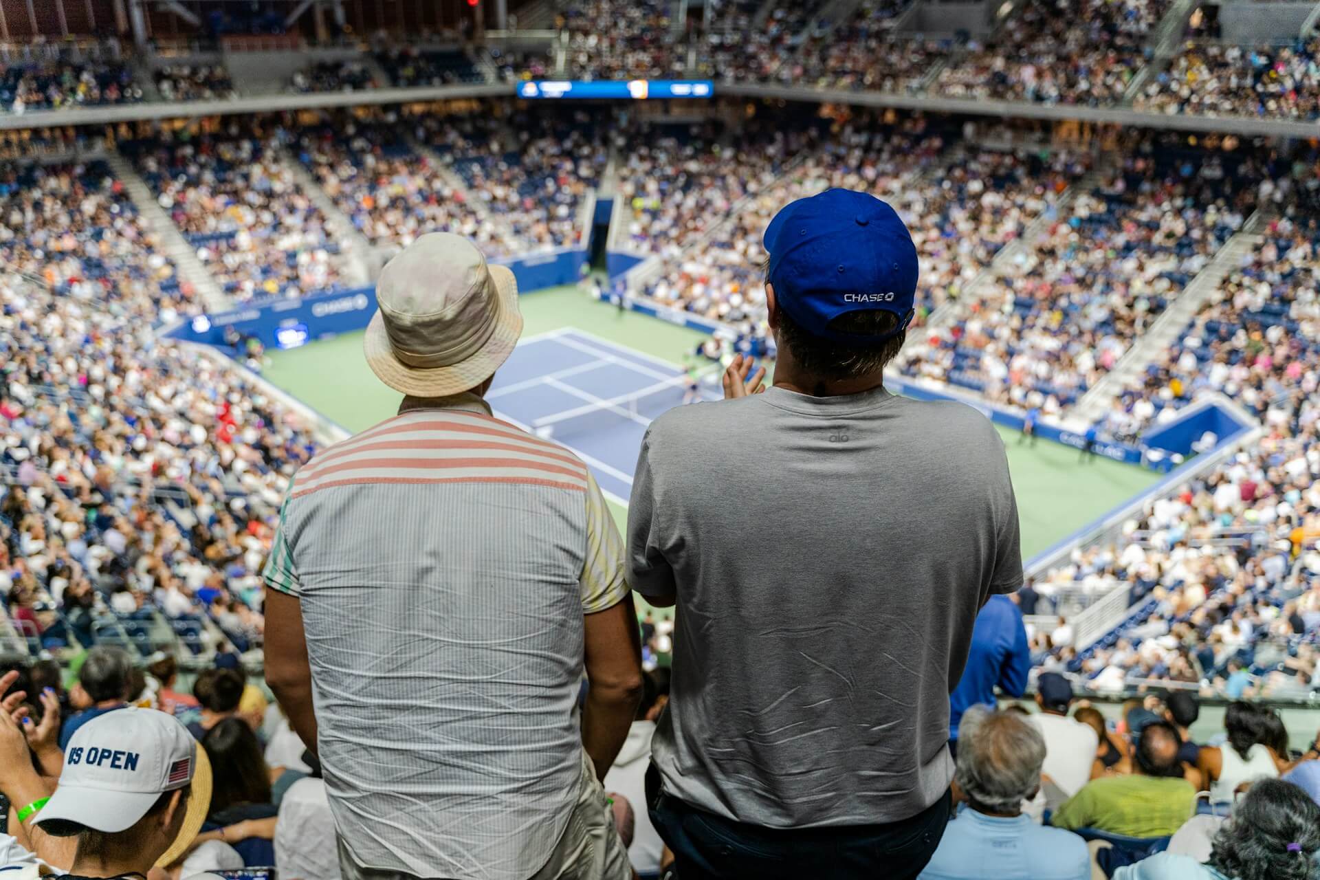 Two people watching a game.