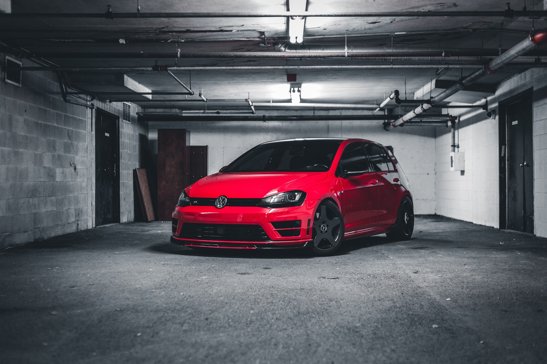 Red car sitting in garage