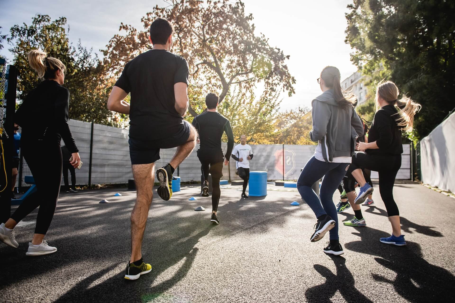 A group of people jogging in place outside