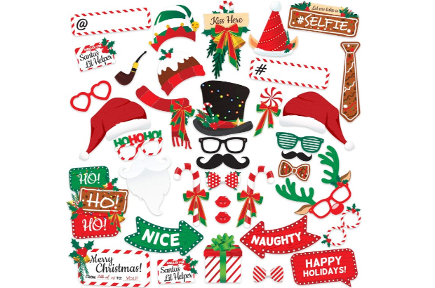 a collection of various sign and face props with holiday sayings