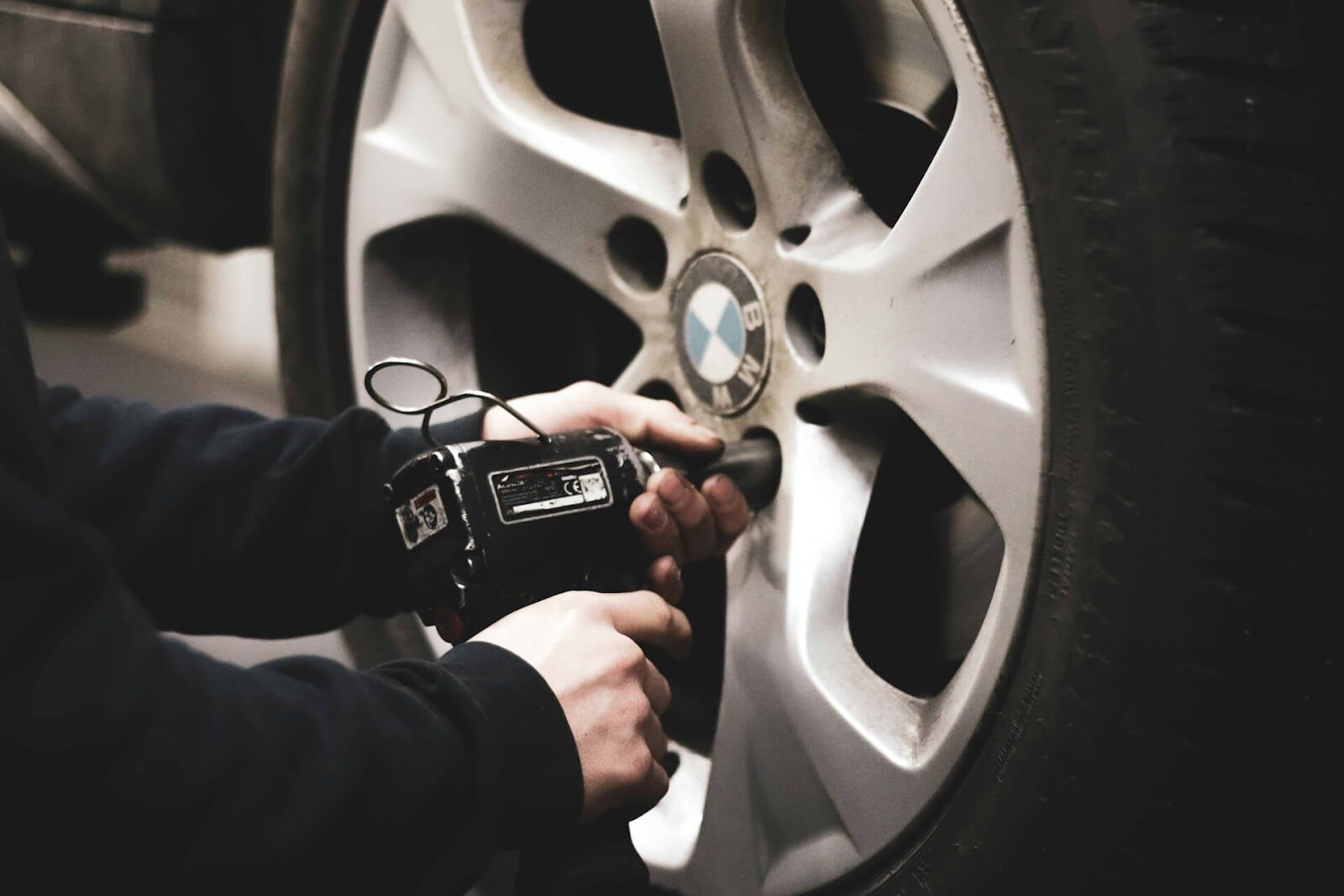 A mechanic working on a tire