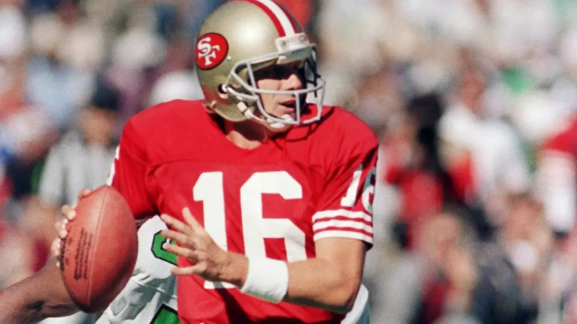 Joe Montana eludes a pass rusher