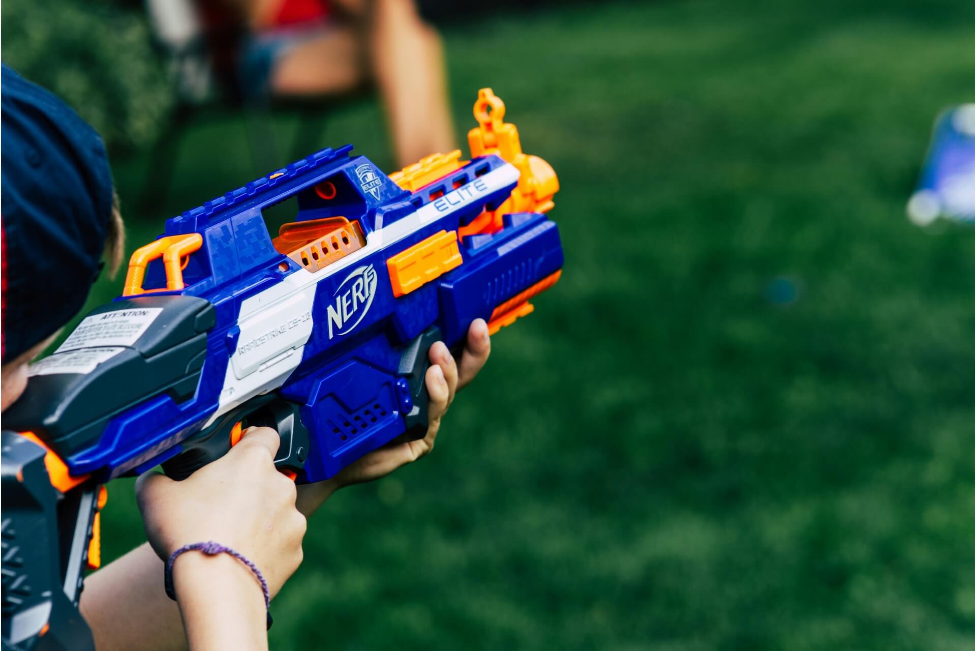 A nerf gun being used in a water gun fight