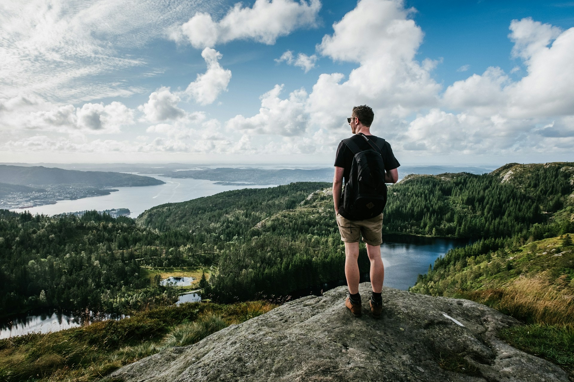 a man overlooking forests and rivers