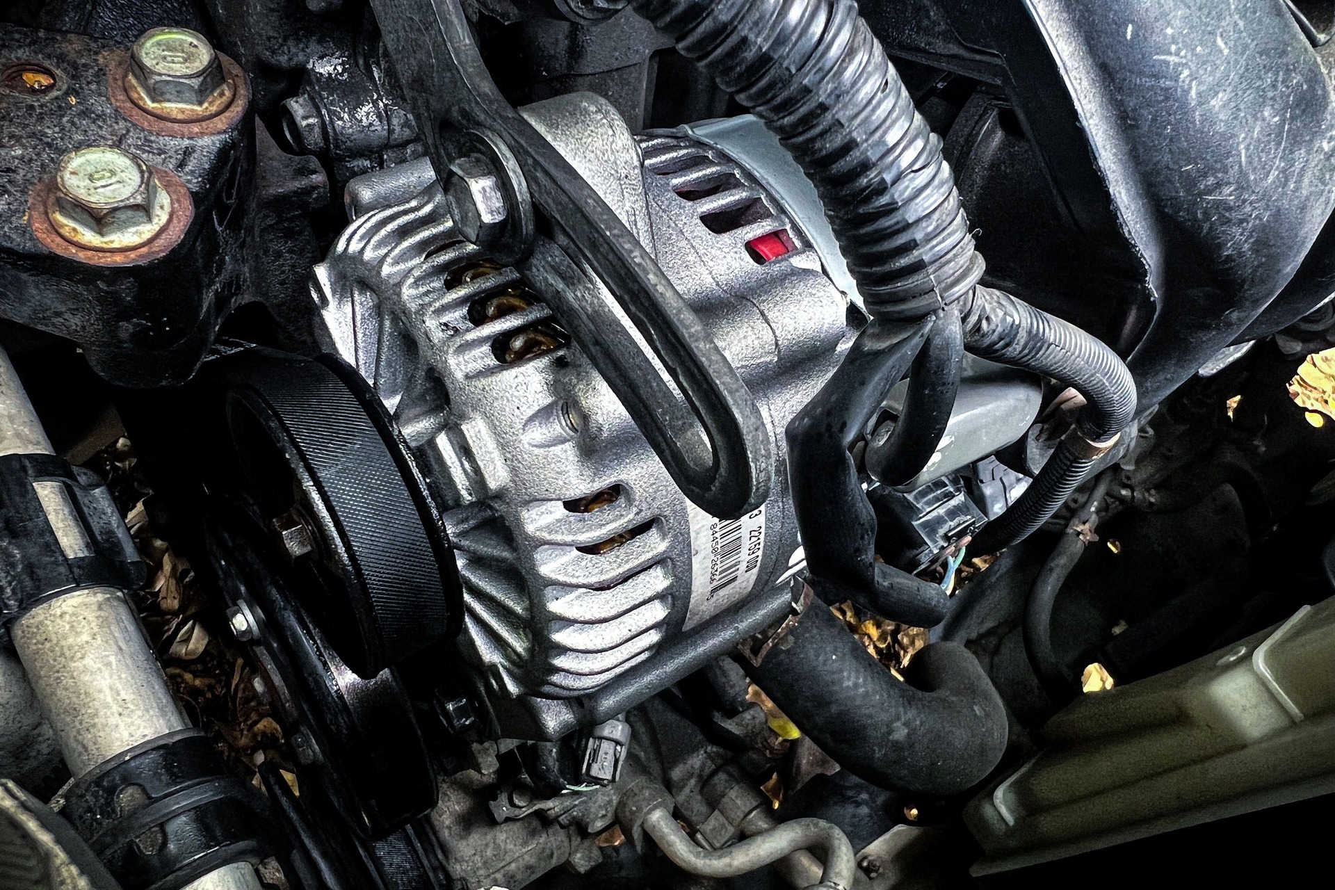 A newly installed car alternator