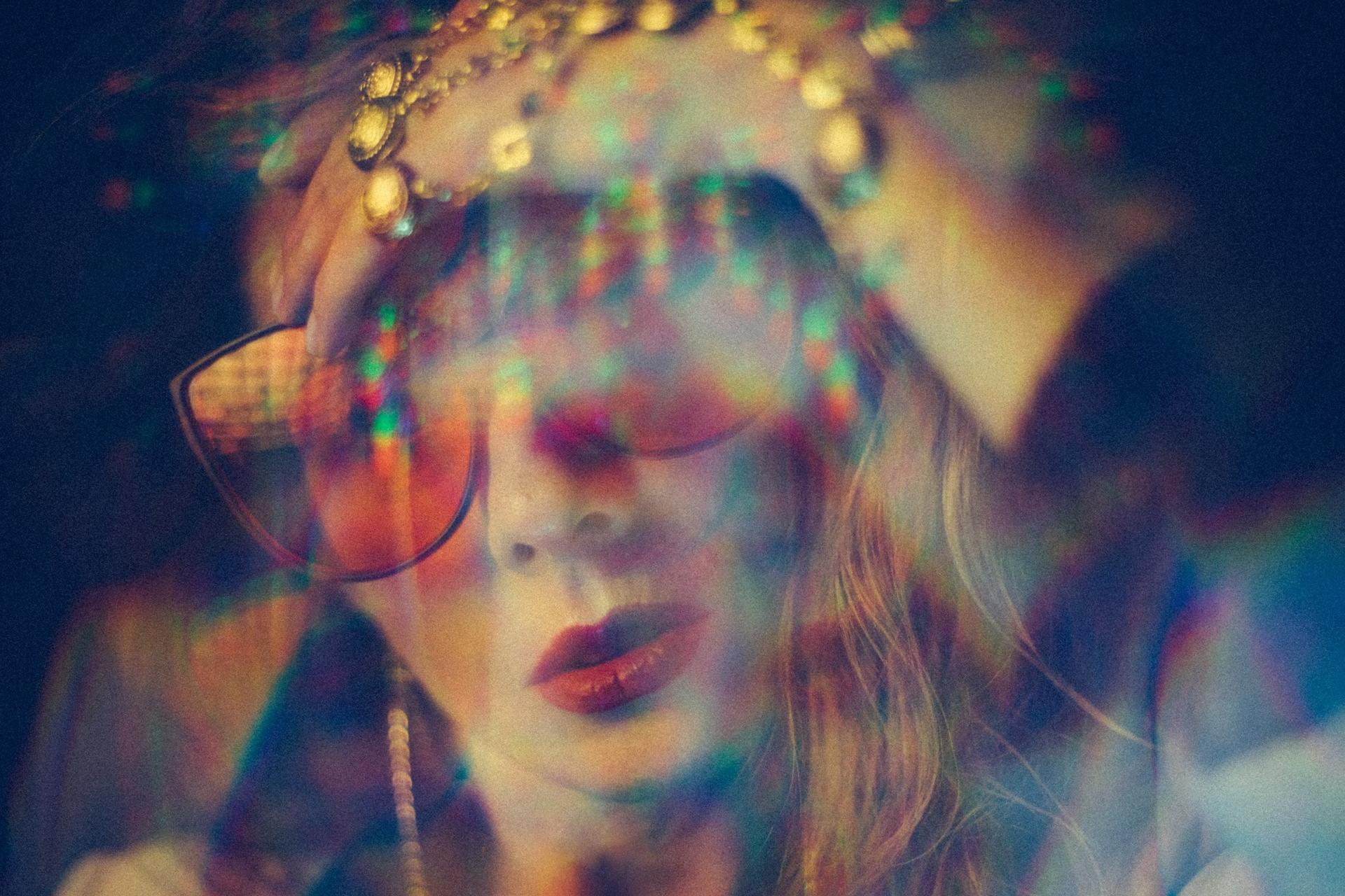 lady wearing sunglasses with rainbow colors
