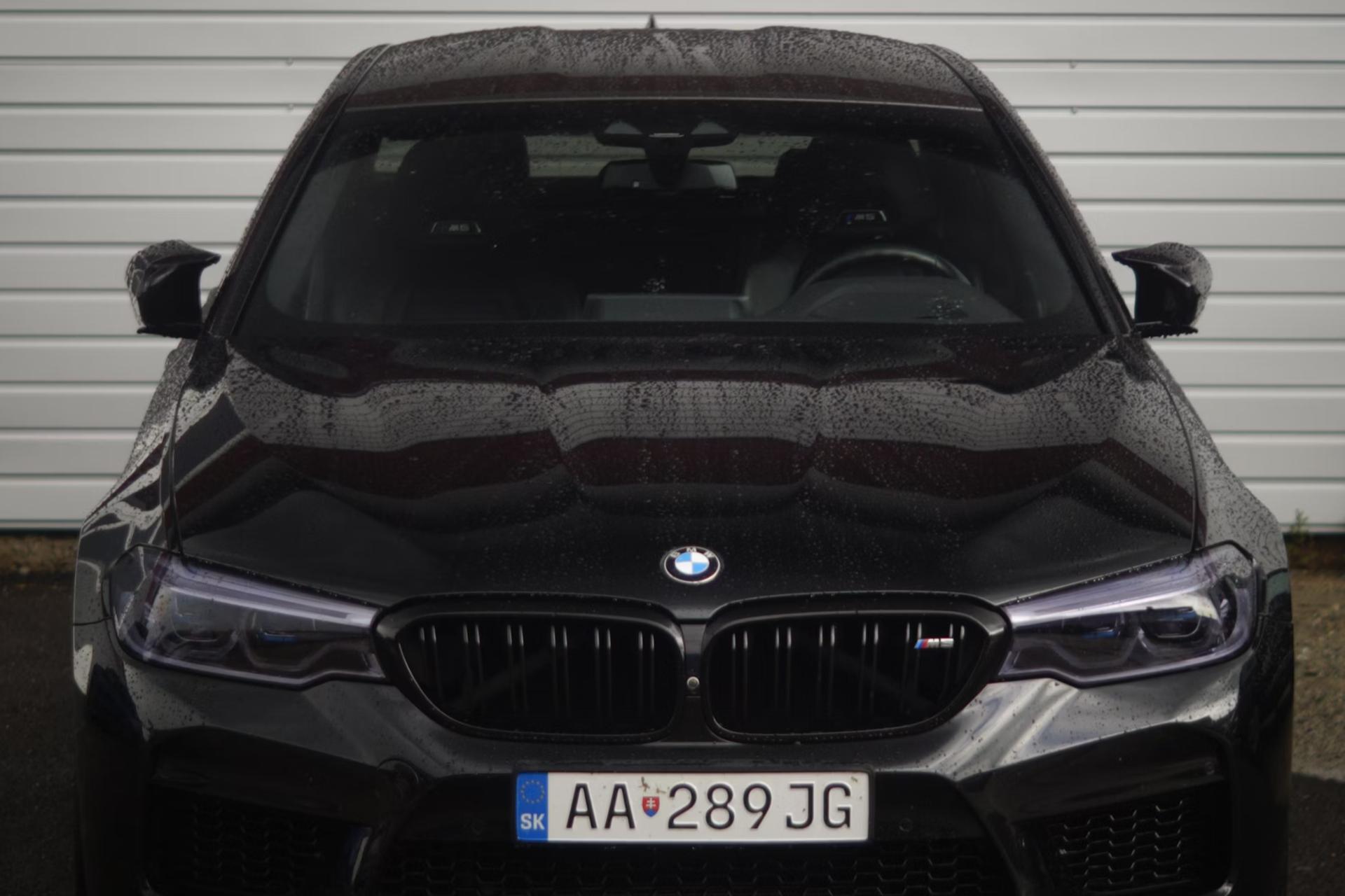 black BMW car with water on it