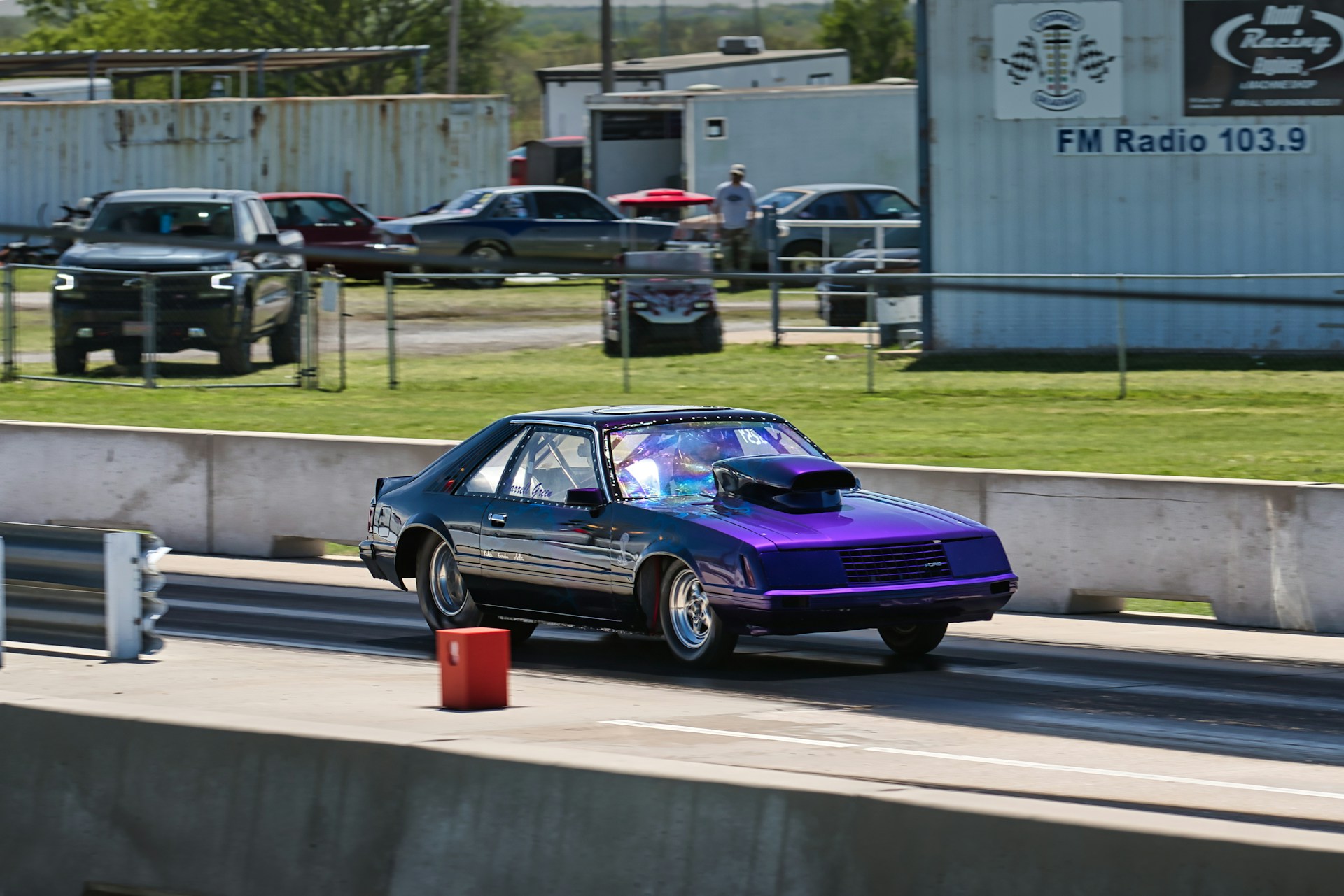 a purple racecar on
Ardmore Dragway