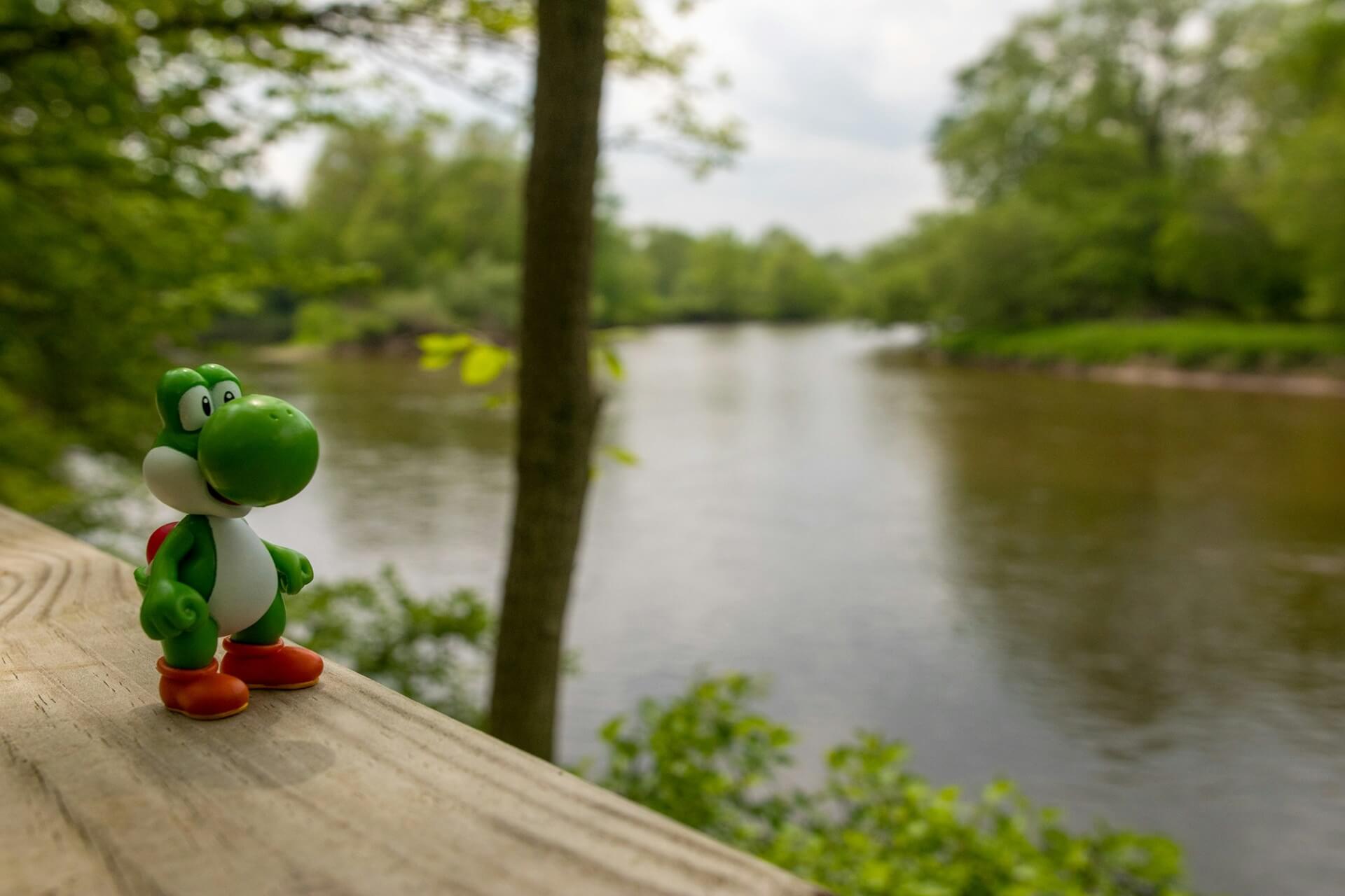 Yoshi figurine sitting on a ledge