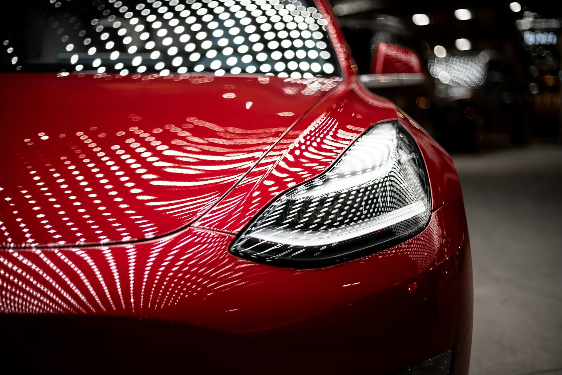 Close-up picture of a red Tesla