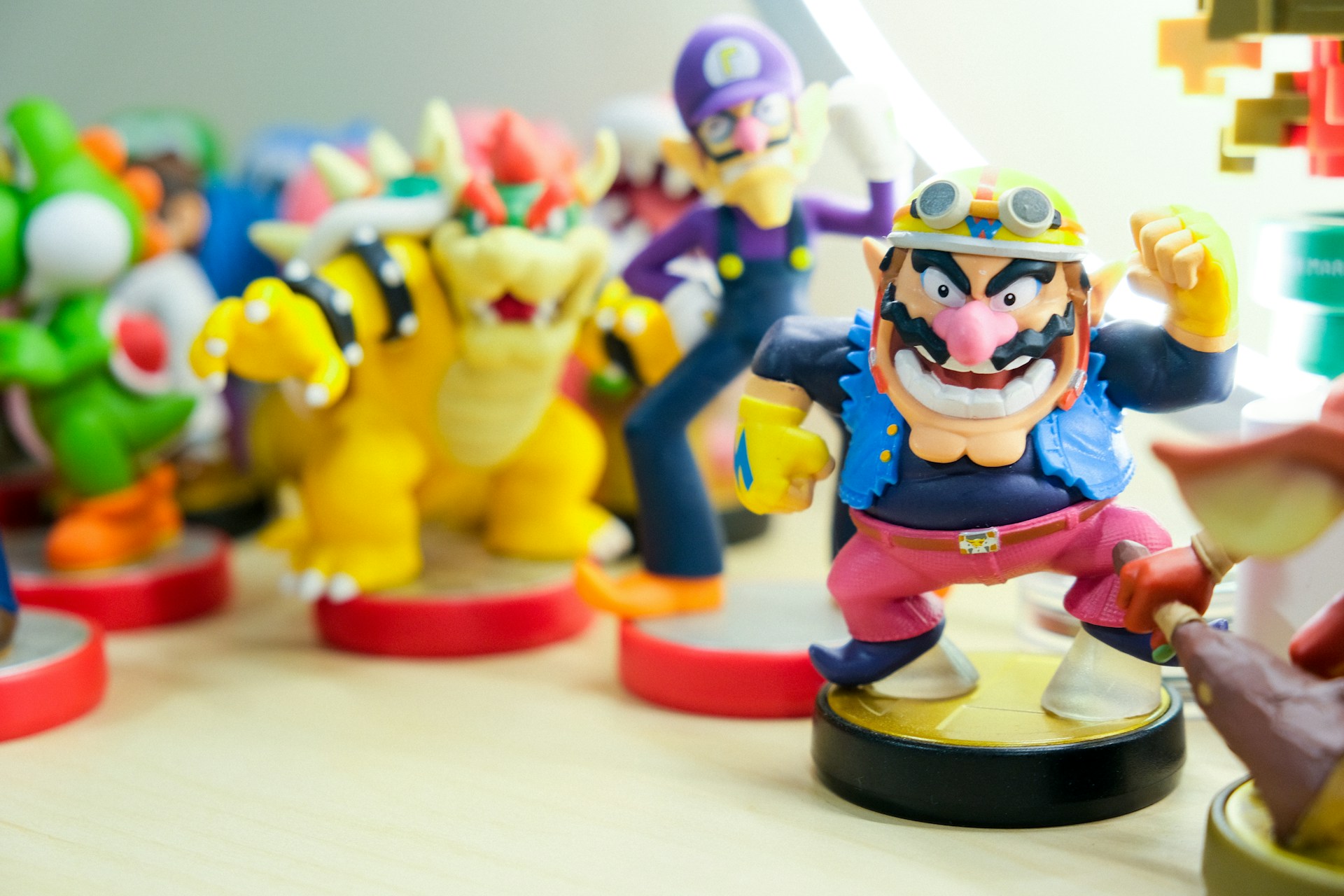 A collection of Amiibos with Wario in the front