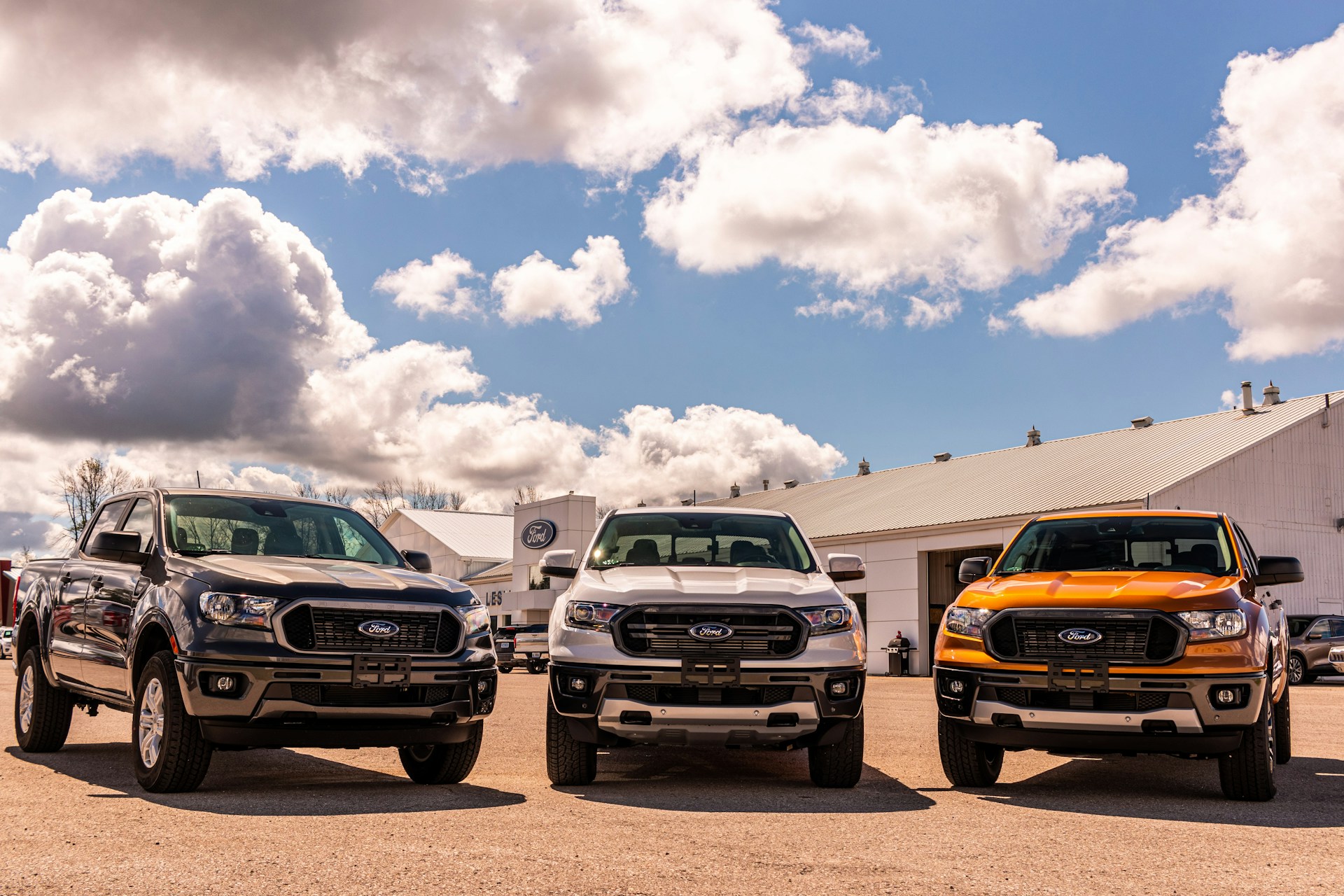 a lineup of three Ford Rangers