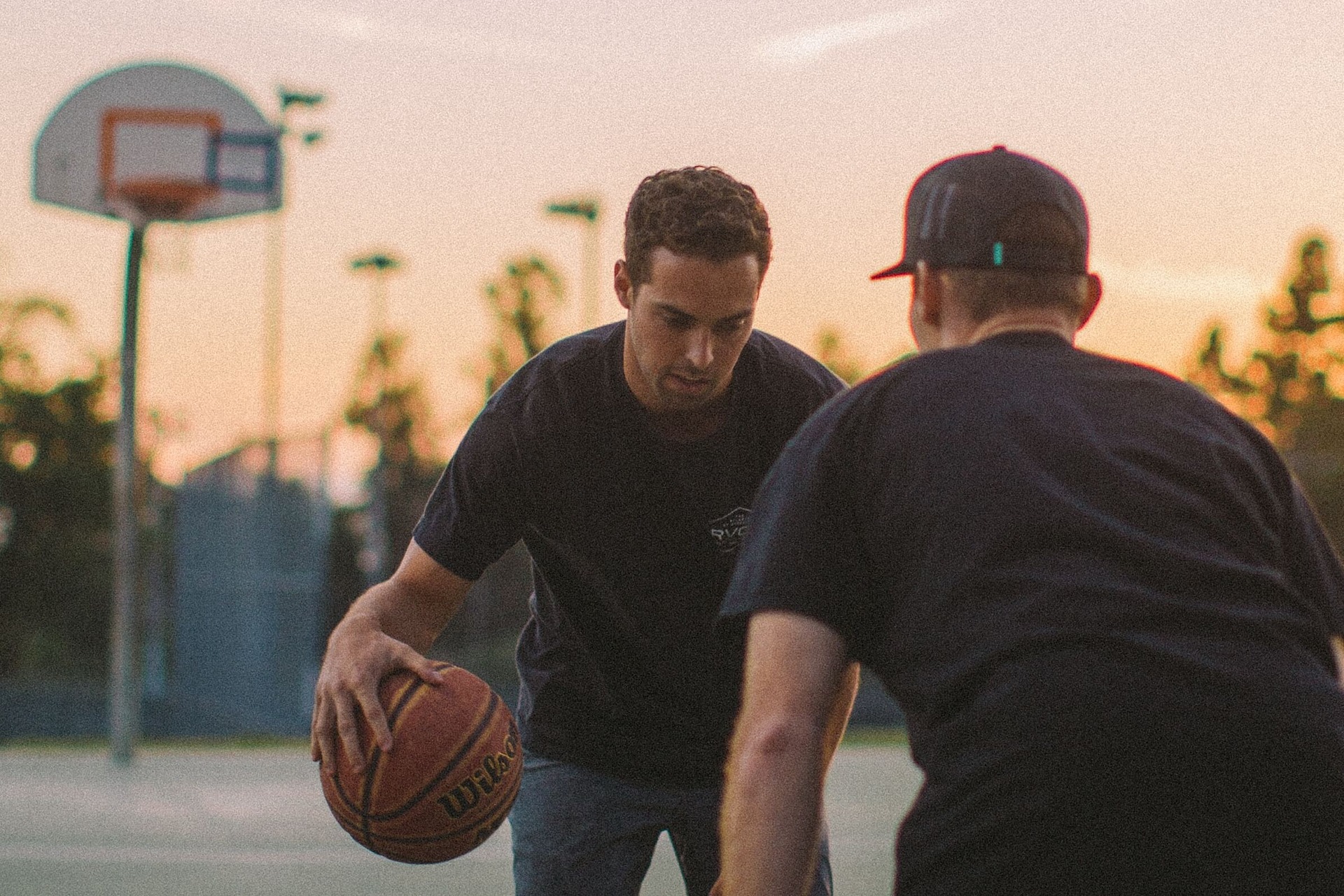 two basketball players facing off