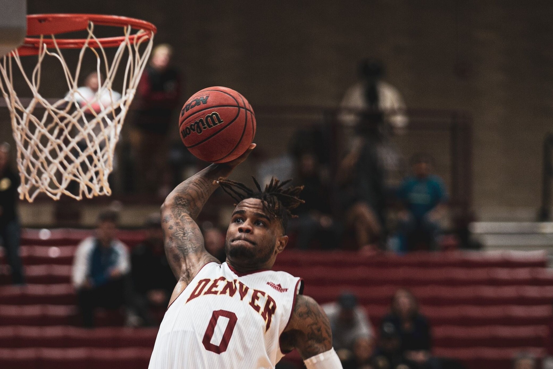 A Denver basketball player dunking
