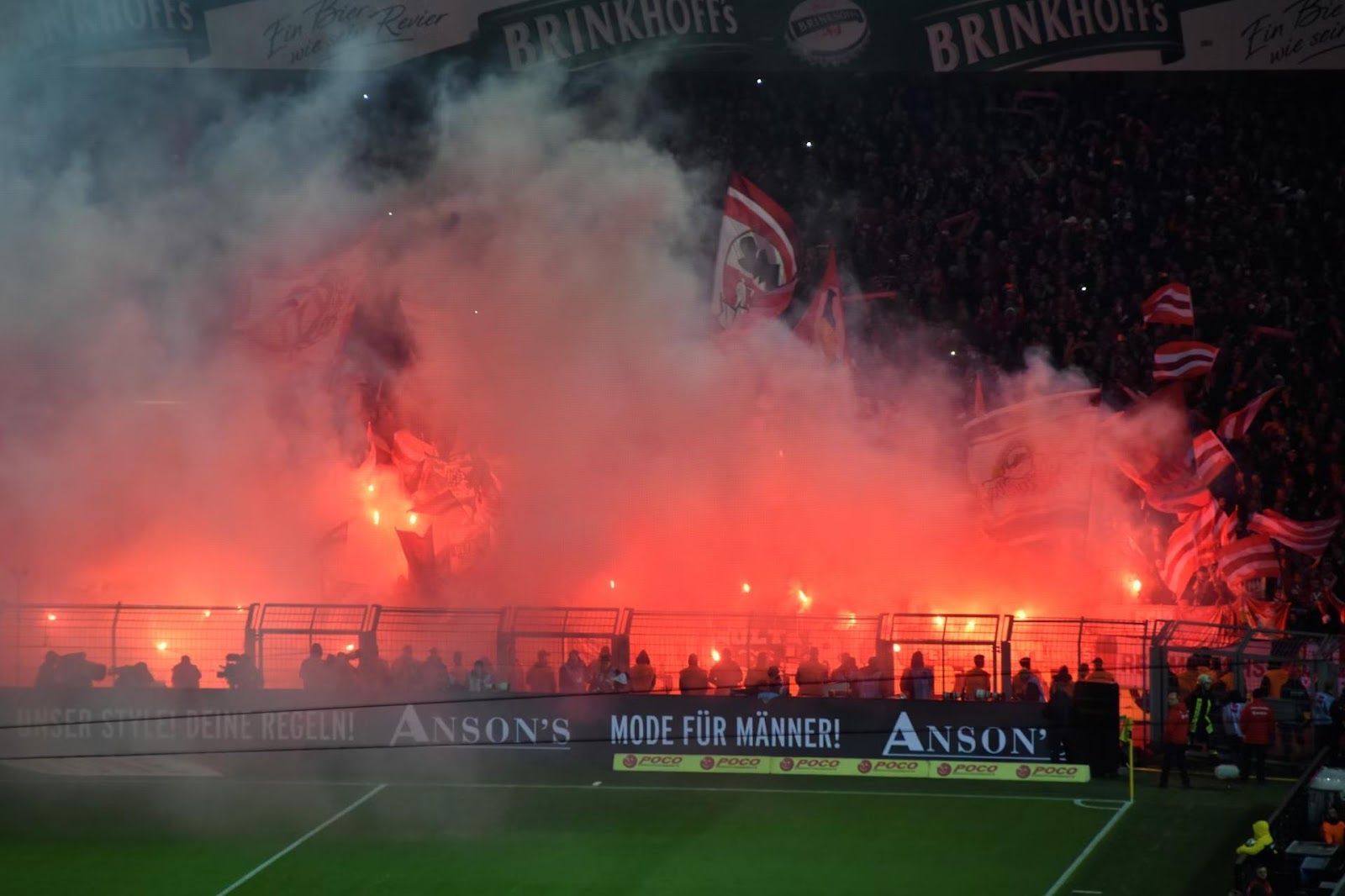 Fans celebrating with flares