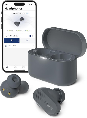 A pair of gray Philips TAT3519 True Wireless Headphones sits against a white background. The gray charging case and an iPhone connected to the headphones sit behind them. They're among the best wireless earbuds on the market.