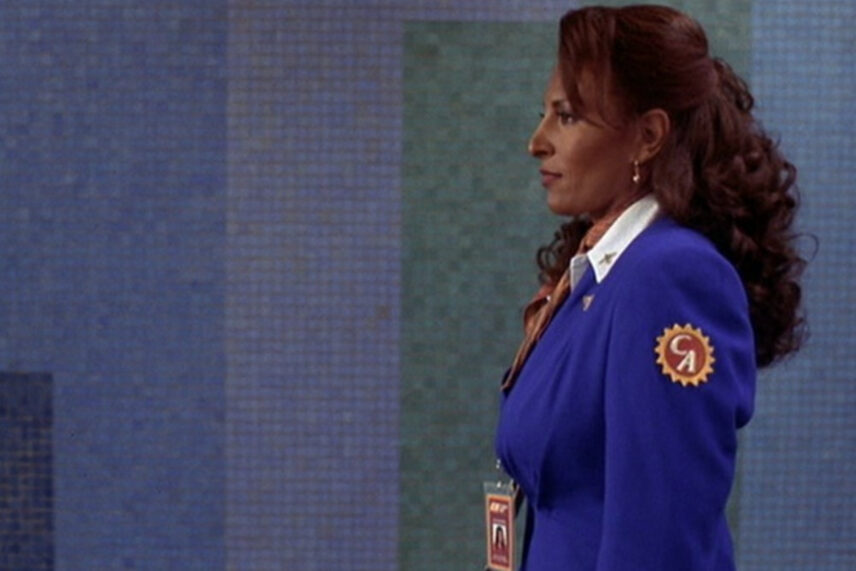 woman in blue uniform in side profile