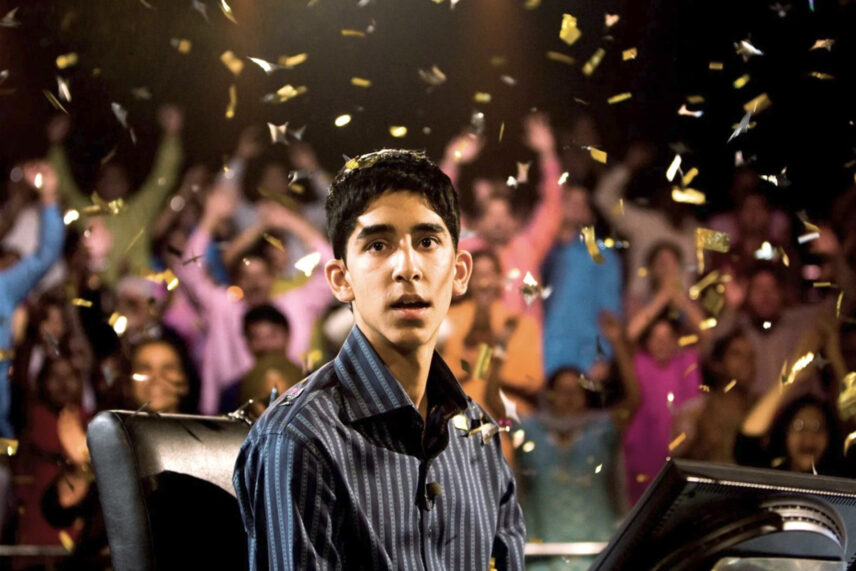 boy in front of crowd with confetti falling