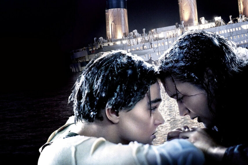 boy and girl looking at each other in front of ship