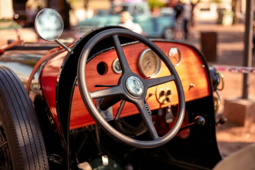 The steering wheel of a vintage Ford
