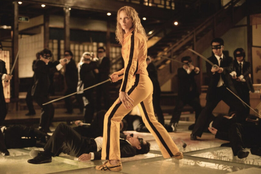 woman in yellow tracksuit with sword
