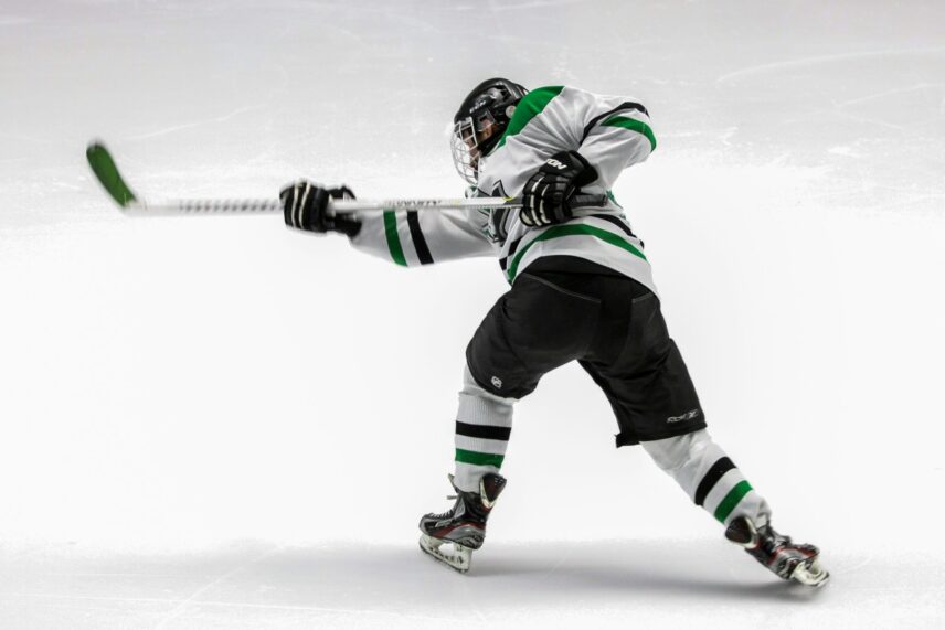 A player hitting the puck.