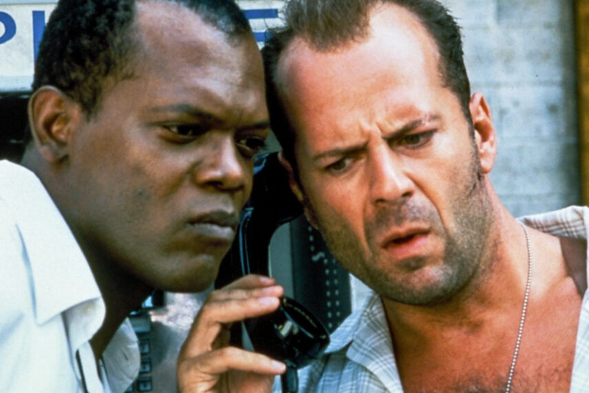 two men listening to old-fashioned black phone