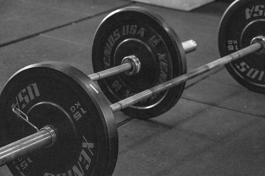 Black and white image of two barbells