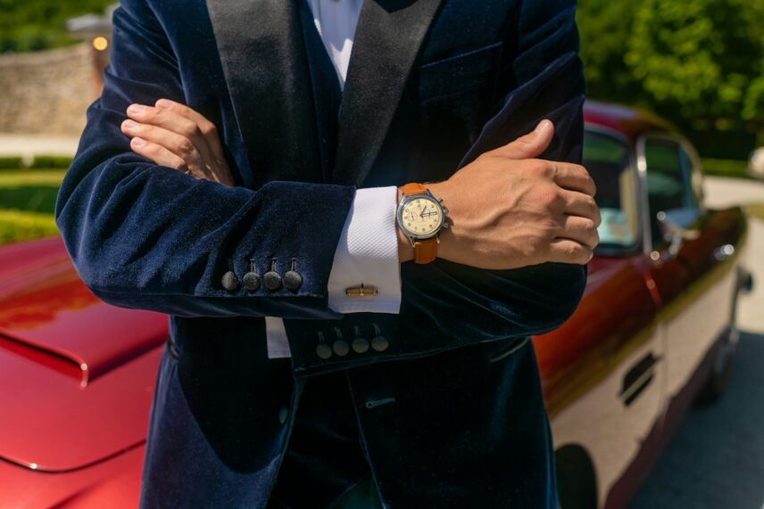 Well-dressed man with arms crossed, classic watch on his wrist