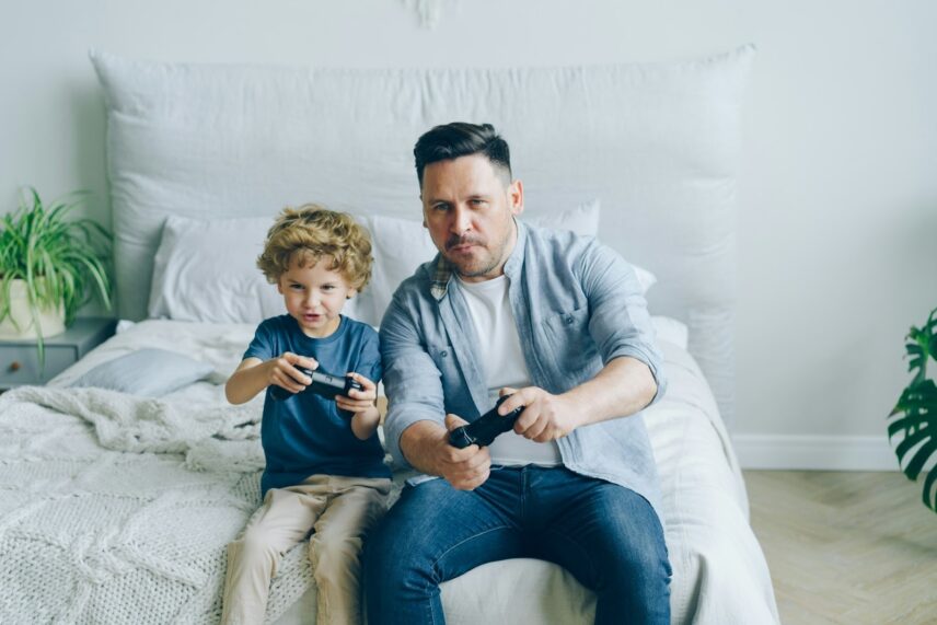 dad and son gaming together
