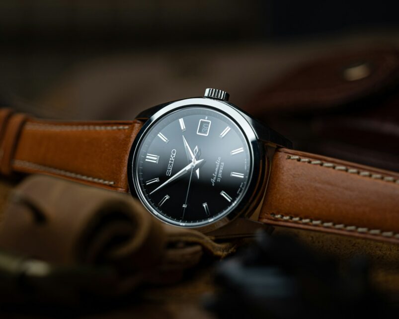 Classic watch with minimalist face and brown leather band