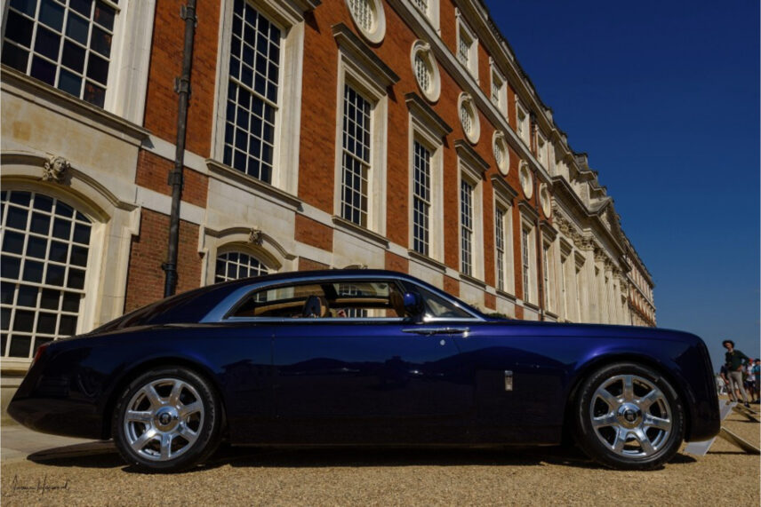 dark blue car parked in front of building