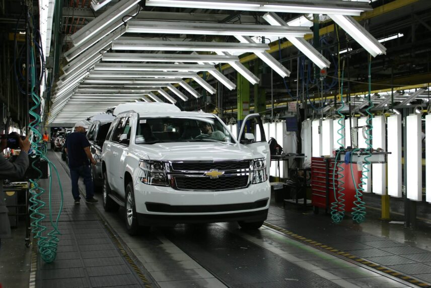 white Chevrolet SUVs in the assembly line