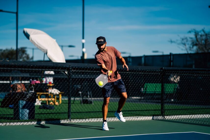 a man playing pickleball
