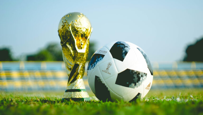 Gold trophy with black and white soccer ball