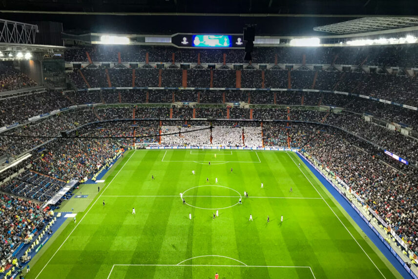 Full stadium with players and fans