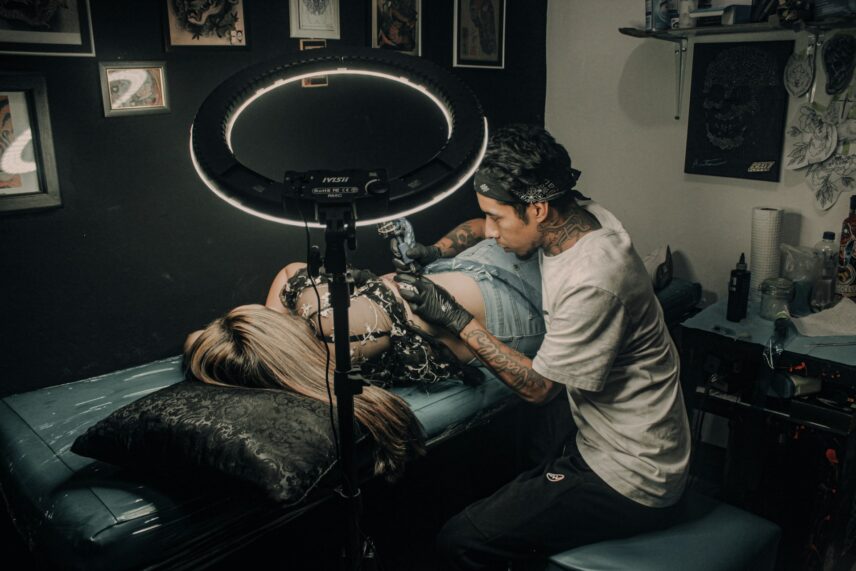 tattoo artist and client