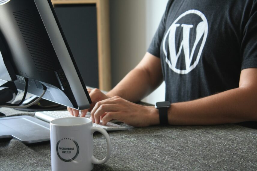 man typing on computer
