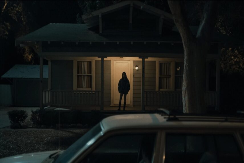 A darkly lit scene from the 2026 horror film Obsession directed by Curry Barker, showcasing the film's controlled visual style