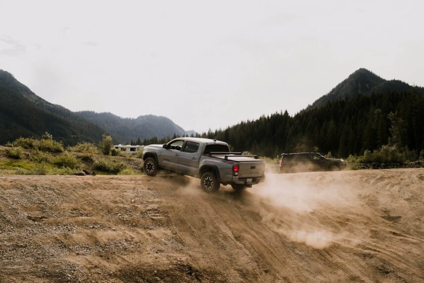Toyota pickup truck driving on a dirt road